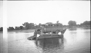 Bus crossing Limpopo river on a ferry, Manjacaze, Mozambique, 1925