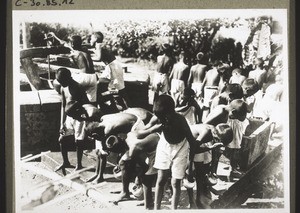 Boys in an orphanage washing in the morning