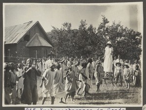 Children snatching cakes, Gonja, Tanzania