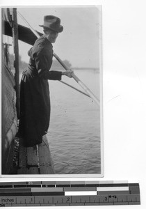 Fr. Eckstein on a boat at Meixien, China, 1936