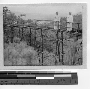 Revs. Raymond Quinn, MM and William J. Downs, MM crossing bridge near Soule,China, 1932