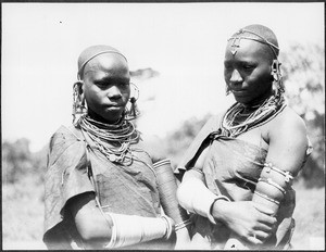 Arusha girls wearing hides and iron ornaments, Tanzania, ca. 1927-1938