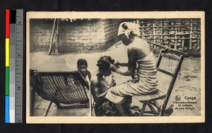 Woman braiding a child's hair, Congo, ca.1920-1940