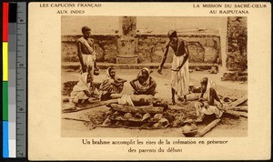 Brahmin performing a cremation ceremony before family, India, ca.1920-1940