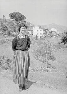 Elly Søgaard Jensen, missionary and nurse, in front of the house with her apartment, Tansen, De