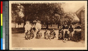 Missionary sisters standing with Congolese lepers, Congo, ca.1920-1940