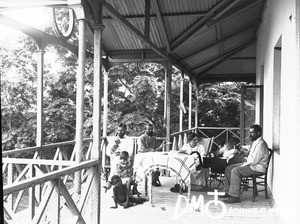 Swiss missionaries on the porch of the mission house, Antioka, Mozambique, ca. 1896-1911