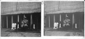 King Lewanika, with three of his councillors on his side, in the yard of his palace in Lealui