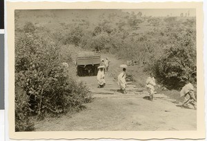 Ethiopian women and truck crossing bridge near Bube, Ethiopia, 1952