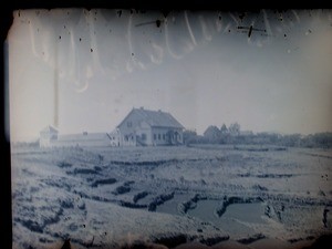 Old guest house with rice fields in the foreground, Antsirabe, Madagascar, ca.1895