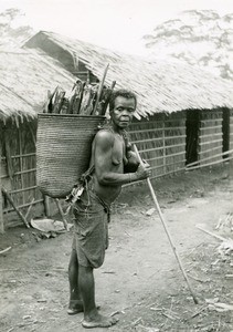 Woman carrying wood, in the leper-house of Ebeigne, Gabon