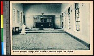 Missionary father standing in an empty school chapel, Congo, ca.1920-1940