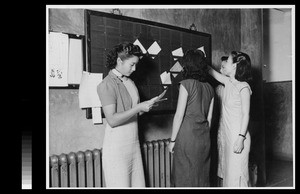 Women students checking their mail at Yenching University, Beijing, China, 1941