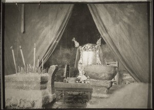 Behind the curtain the empty place for the town deity, in front the table where he used to stand, in the foreground urns for incense