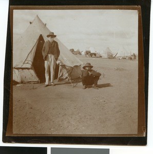 Old Boer with his son in front of a tent in the camp near Mafikeng, South Africa, ca.1901-1903