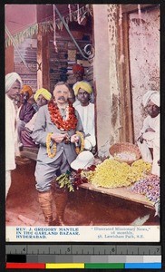 Missionary wearing floral wreath in market, Hyderabad, India, ca.1920-1940