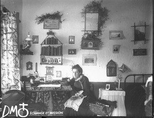 Female missionary at desk, Valdezia, South Africa, ca. 1896-1911