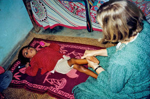 United Mission to Nepal. DSM Missionary Ellinor Kirkegaard Pedersen giving a disabled child phy