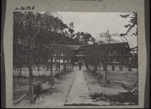 Mission station Tschonglok: view of the school yard and the Sensang house (on the right), seen from the mission house