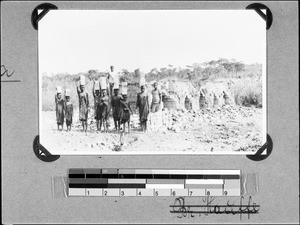 Women and girls carrying bricks, Nyasa, Tanzania, 1938