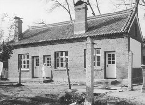 Chinese nursing building built in 1929 with the stone pillars at the place for drying