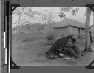 Woman cooking at the hospital, Sikonge, Unyamwezi, Tanzania