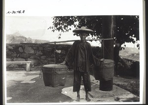 Chinese carrying two panniers