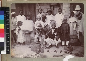 Magician performing tricks for audience of children, Madagascar, ca. 1913