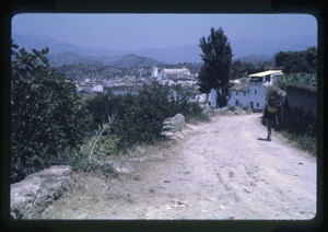 village with houses in the foreground and mountains in the background