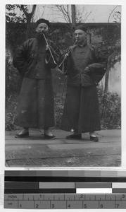 Two European missioners smoking, China, ca. 1910-1930