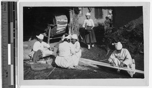 Four elderly Korean women setting up a loom, Korea, ca. 1937