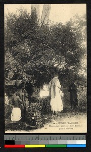 Catholic priest celebrating Mass beneath a tree, Guinea, ca.1920-1940