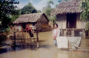 Beatrice Basalong on a visit to the village of Ampil during a flood, 2002