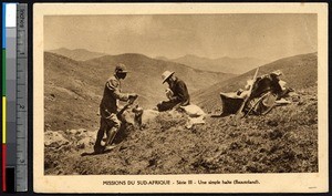 Missionary father and an indigenous man rest on a hillside, Lesotho, ca.1900-1930