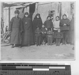 Maryknoll Sisters with a family at Dalian, China