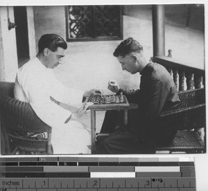 Maryknoll priests playing chess at Wuzhou, China, 1931