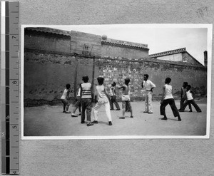 Harwood Bible Training School students in basketball game with children, Fenyang, Shanxi, China, 1936