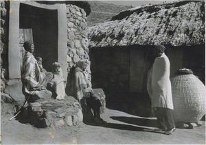 A Mossouto family at the entrance of her hut