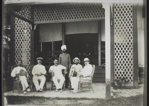 Group at the entrance of the Kudat Hotel. Rev. Ebert."