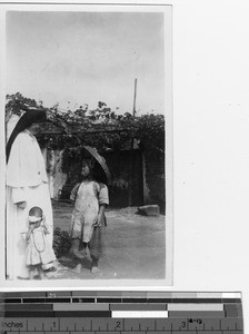 A Maryknoll Sister with children at Yangjiang, China, 1949