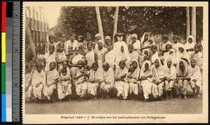 Missionary sister with people assembled for a group photograph, India, ca.1920-1940