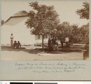 King Jakobus More Mamogale with family in front of his house, South Africa