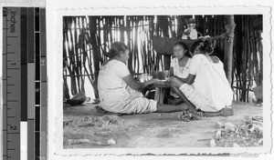 Three Mayas making tortillas, Quintana Roo, Mexico, April 1946