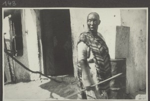 An African woman reacting angrily to having her photograph taken