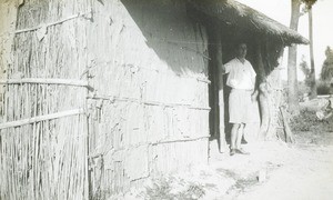 Male missionary in doorway, Congo, ca. 1920-1930