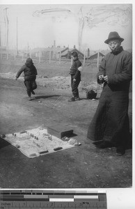 Selling eyeglasses on the roadside at Fushun , China, 1937