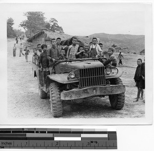 Native children in a jeep at Kunming, China, 1947