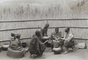 Bassouto men drinking "leting" inside the "lelapa"