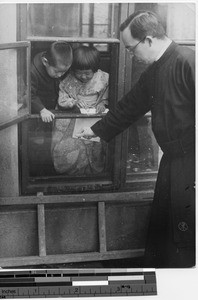 Fr. Escalante with children in Fushun, Manchuria, China, 1938