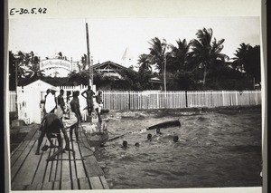 Basel Mission store. Jetty. Submerged boat